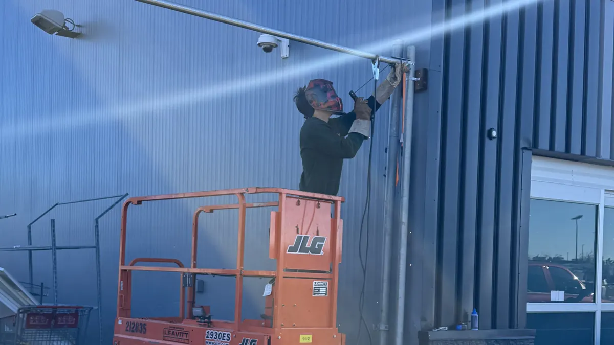 Mobile welder repairing equipment on site in Edmonton